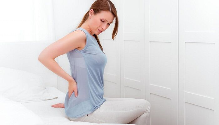 The woman is worried about back pain